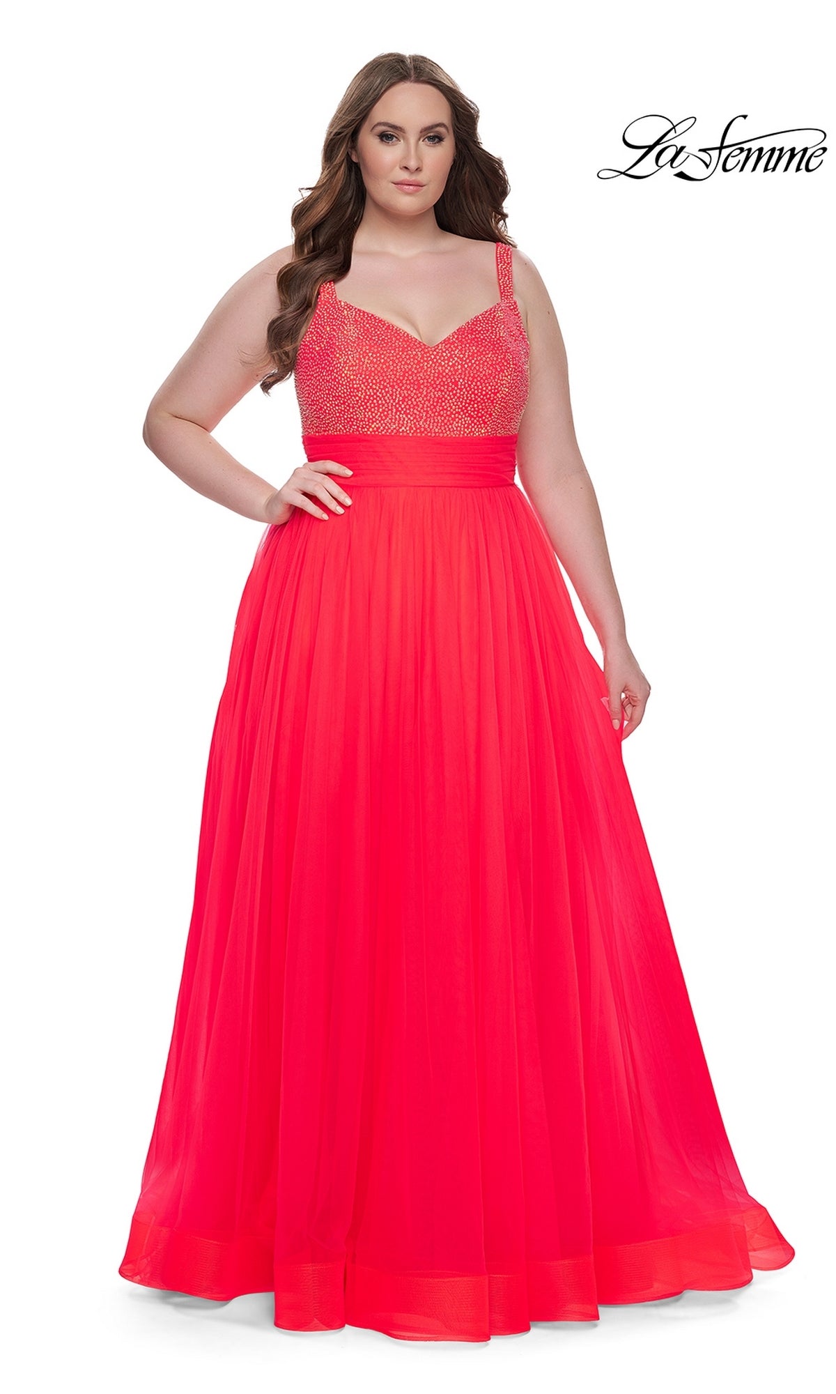 A woman models the La Femme Long Prom Dress 31251—sleeveless, floor-length, bright pink with a beaded bodice and flowing skirt—against a plain white background. The La Femme logo is shown in the top right corner.